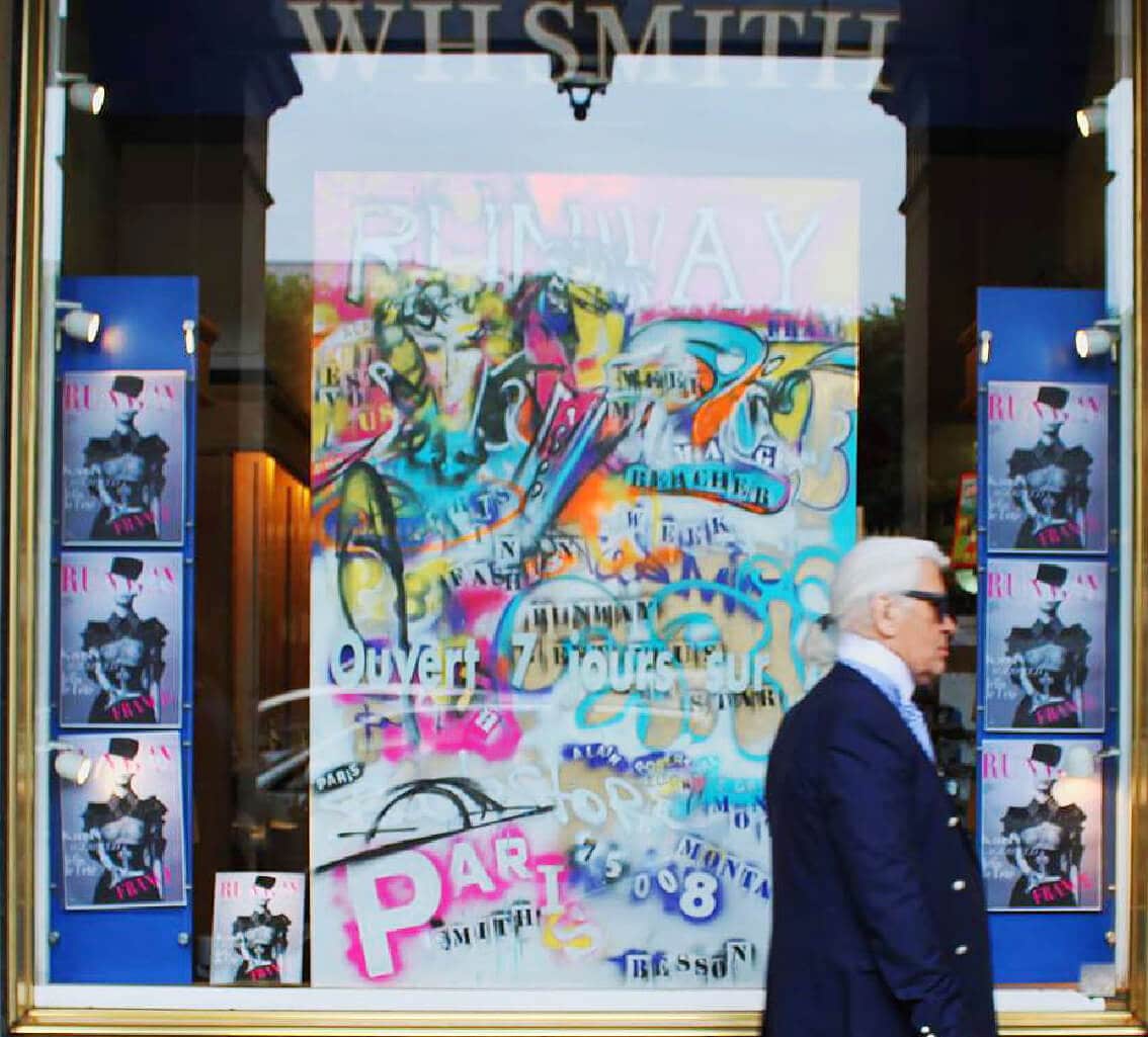 Karl Lagerfeld goes to RUNWAY MAGAZINE official party in WHSmith store on rue Rivoli, Paris