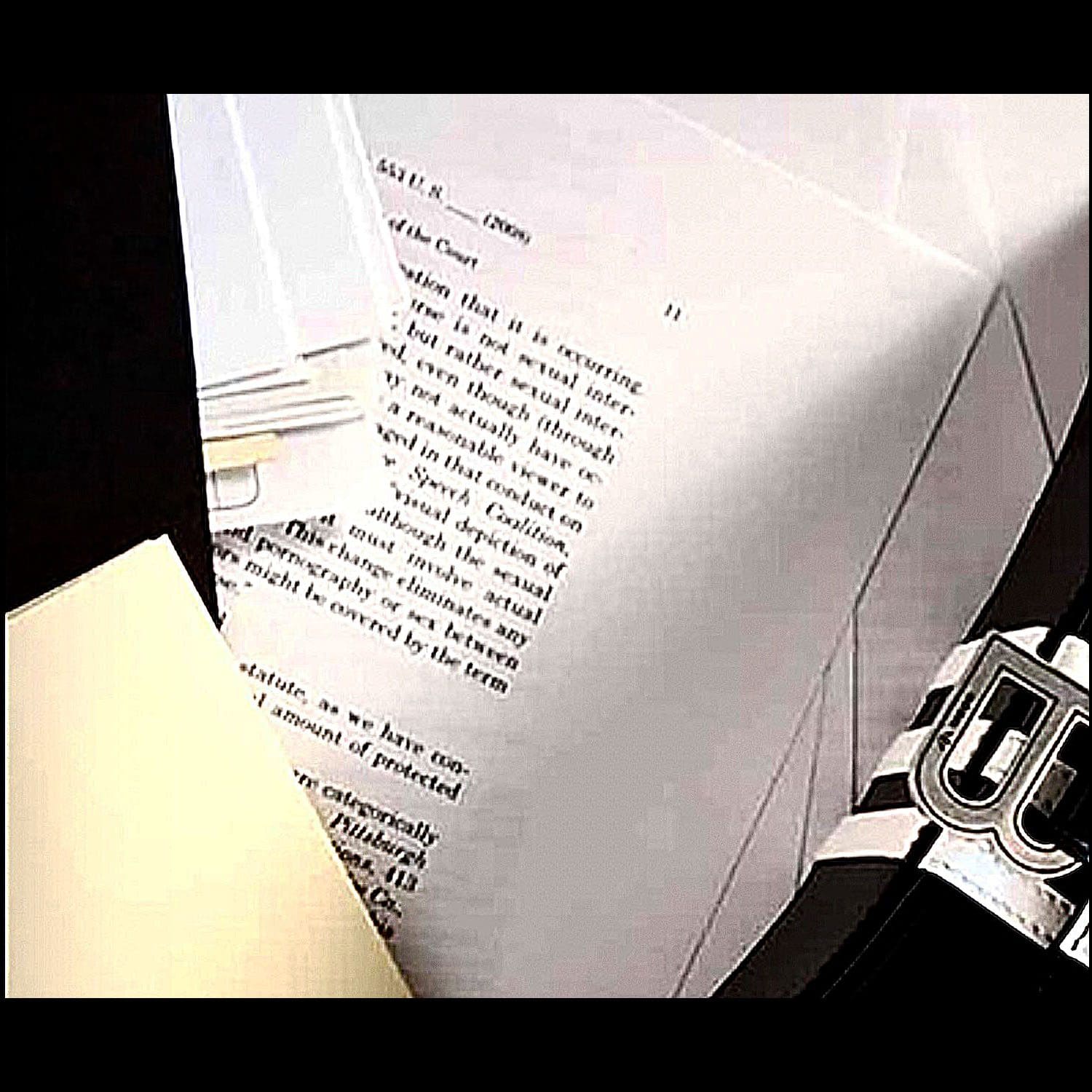 2 Balenciaga commercial with photocopy of an excerpt of a court document ruling on child pornography