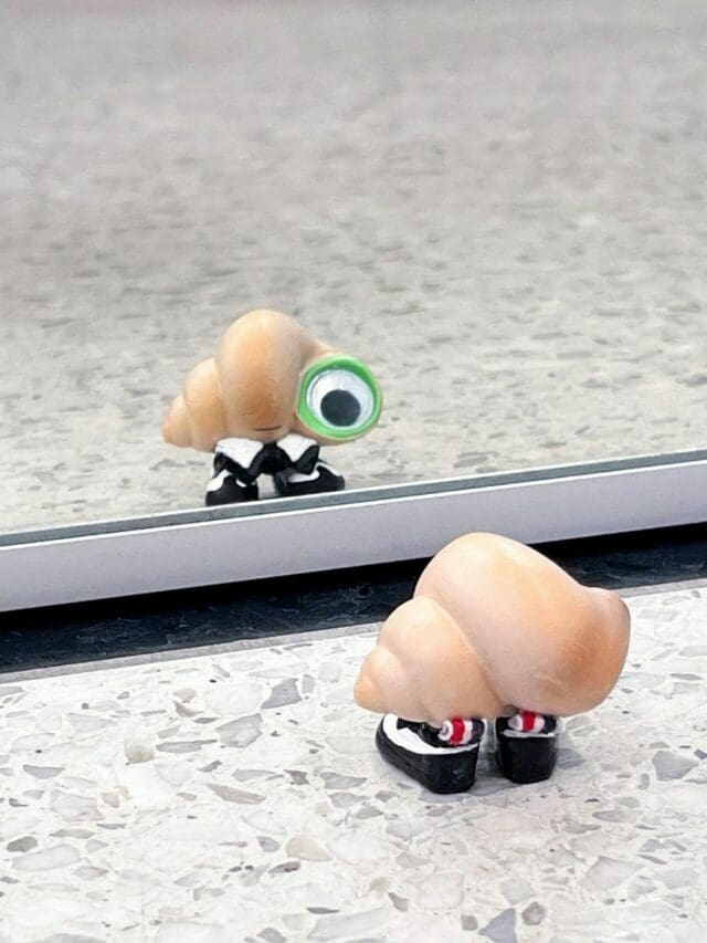 Marcel The Shell With Shoes On dressed by Thom Browne for Oscars 2023