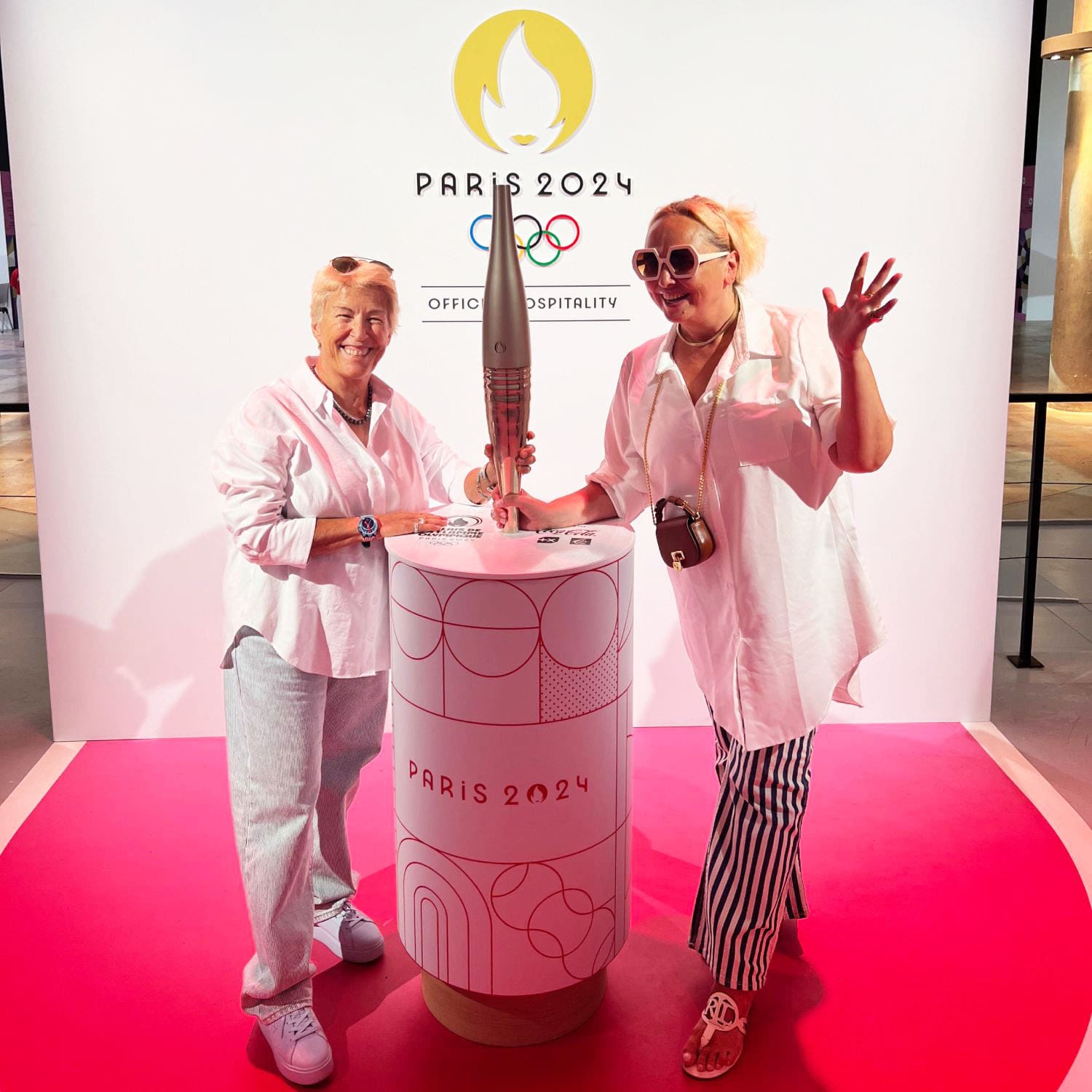 Clubhouse 24 Olympics Hospitality On Location - Eleonora de Gray, Editor-in-Chief, and Guillaumette Duplaix, Executive Editor -RUNWAY MAGAZINE - with Olympic Flame